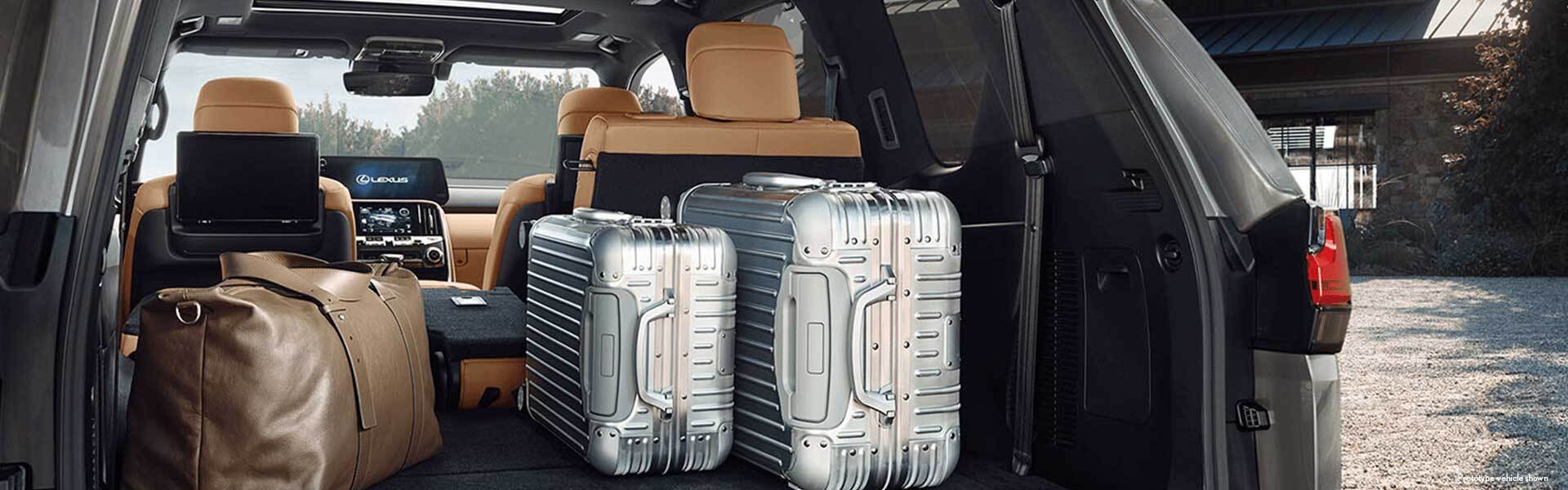 Detail shot of the open trunk of the 2022 Lexus LX 600 with luggage.