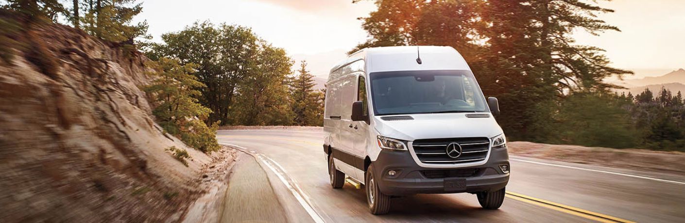 An image of the side view of a grey colored 2023 Mercedes-Benz Sprinter
