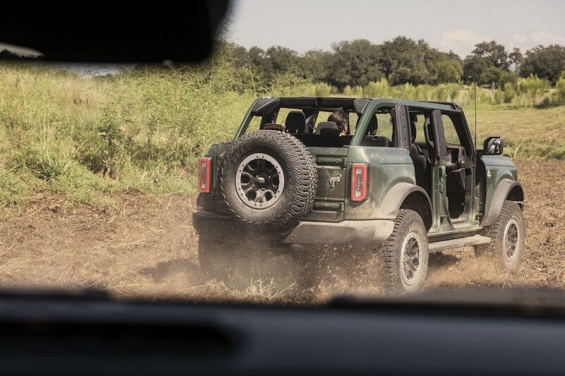 People off-roading in a 2023 Ford Bronco