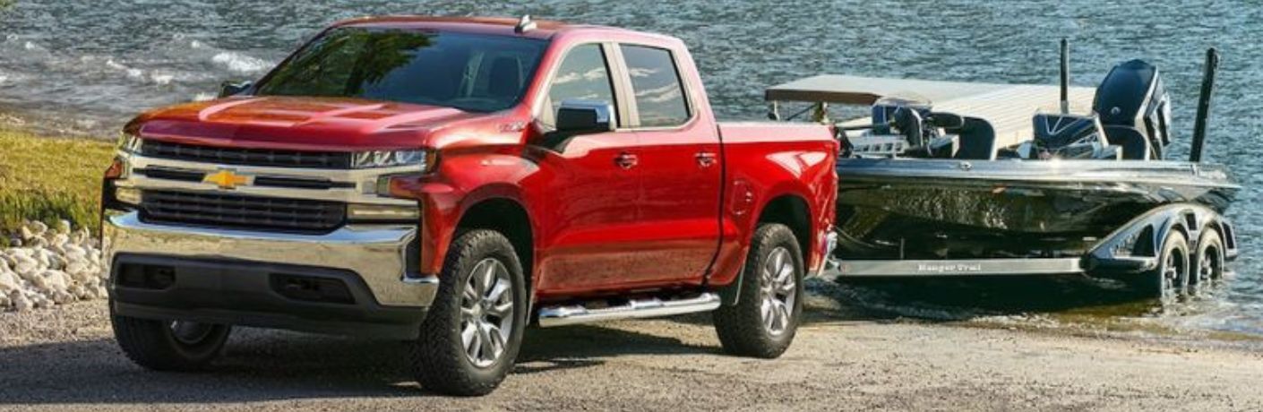 Front three-quarter view of the 2022 Chevrolet Silverado pulling a boat