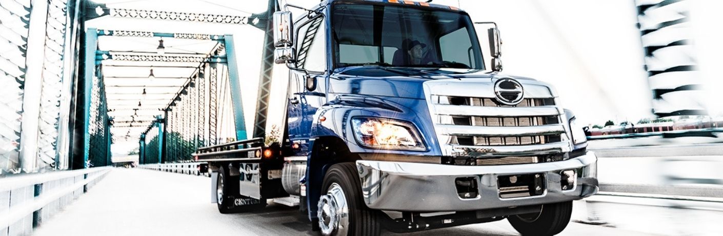 a Used Hino Truck driving through a bridge
