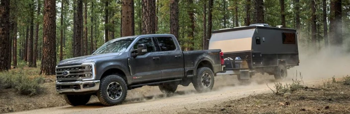 2024 SD F-450 Gray towing a trailer