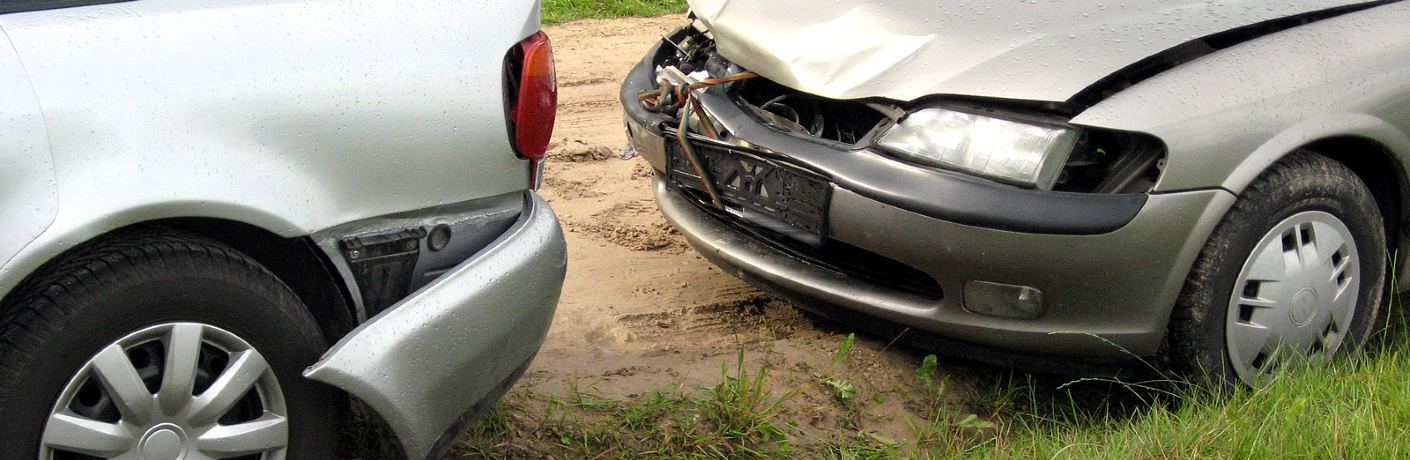 Two damaged vehicles by each other