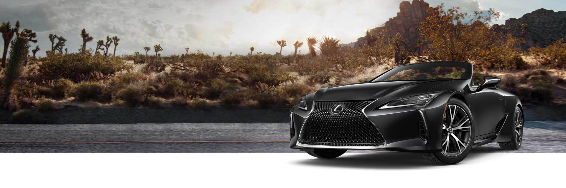 Exterior of the Lexus LC 500 Convertible shown in Caviar on a desert background. 