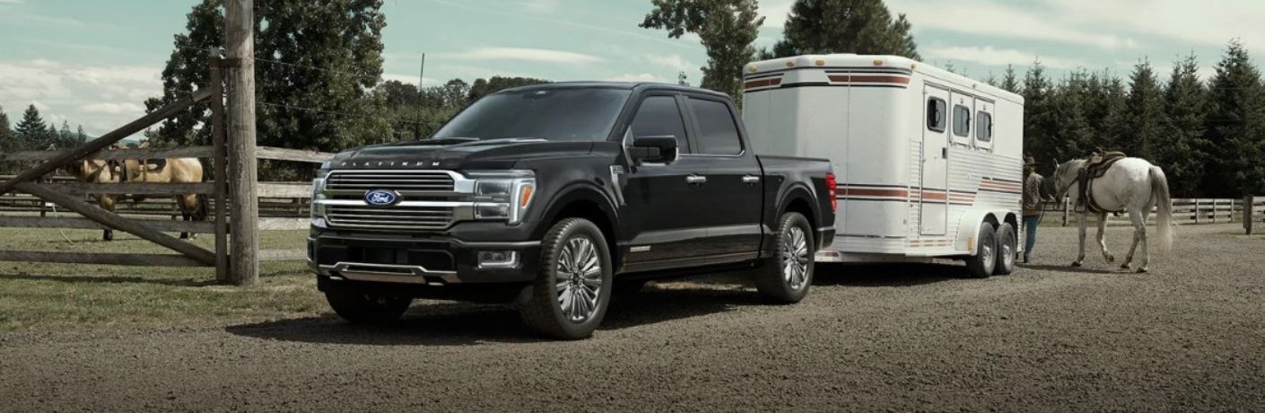 2025 Ford F-150 towing a trailer on a horse farm