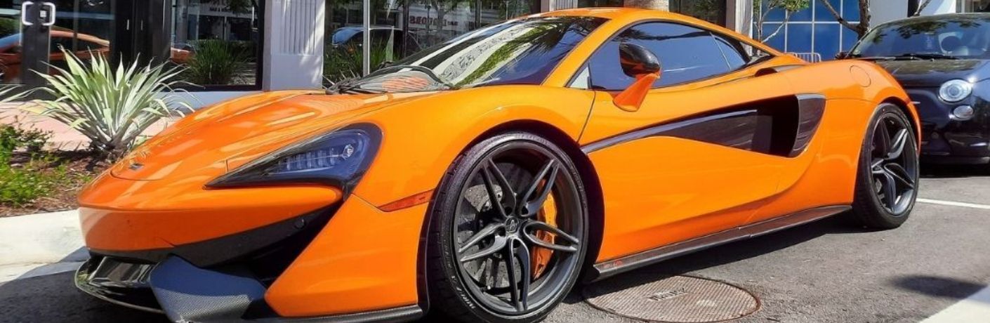 front and side view of a McLaren parked on the side of the road