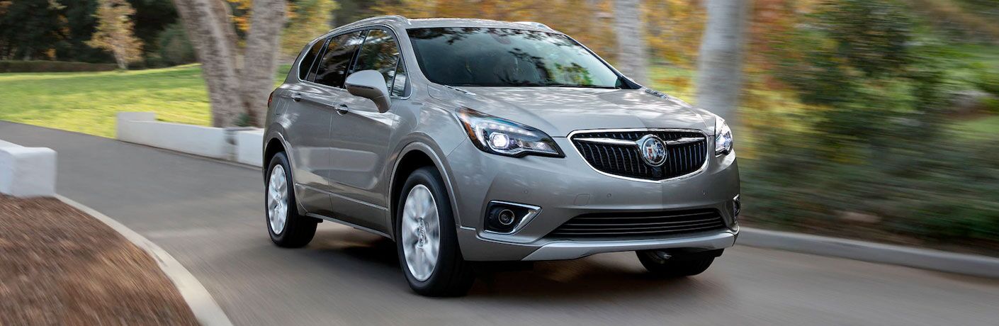 Silver 2020 Buick Envision on a path