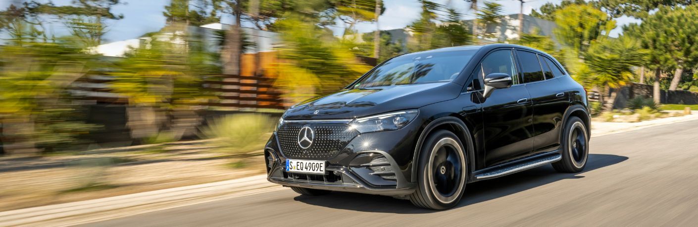 Front three quarter view of the 2024 Mercedes-Benz EQE Sedan on road