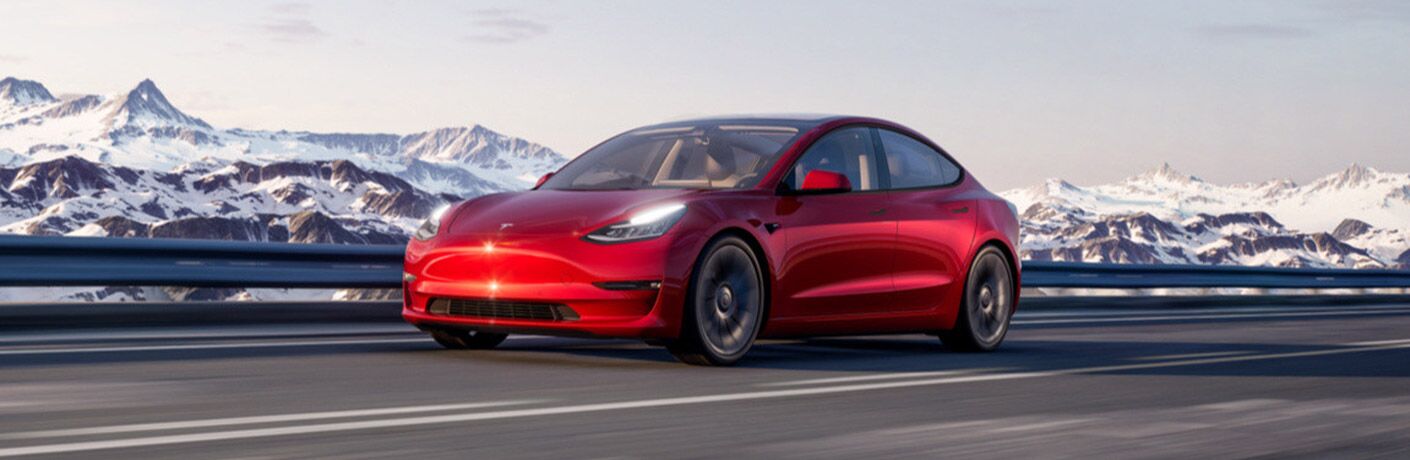 2021 Tesla Model 3 Red on the road
