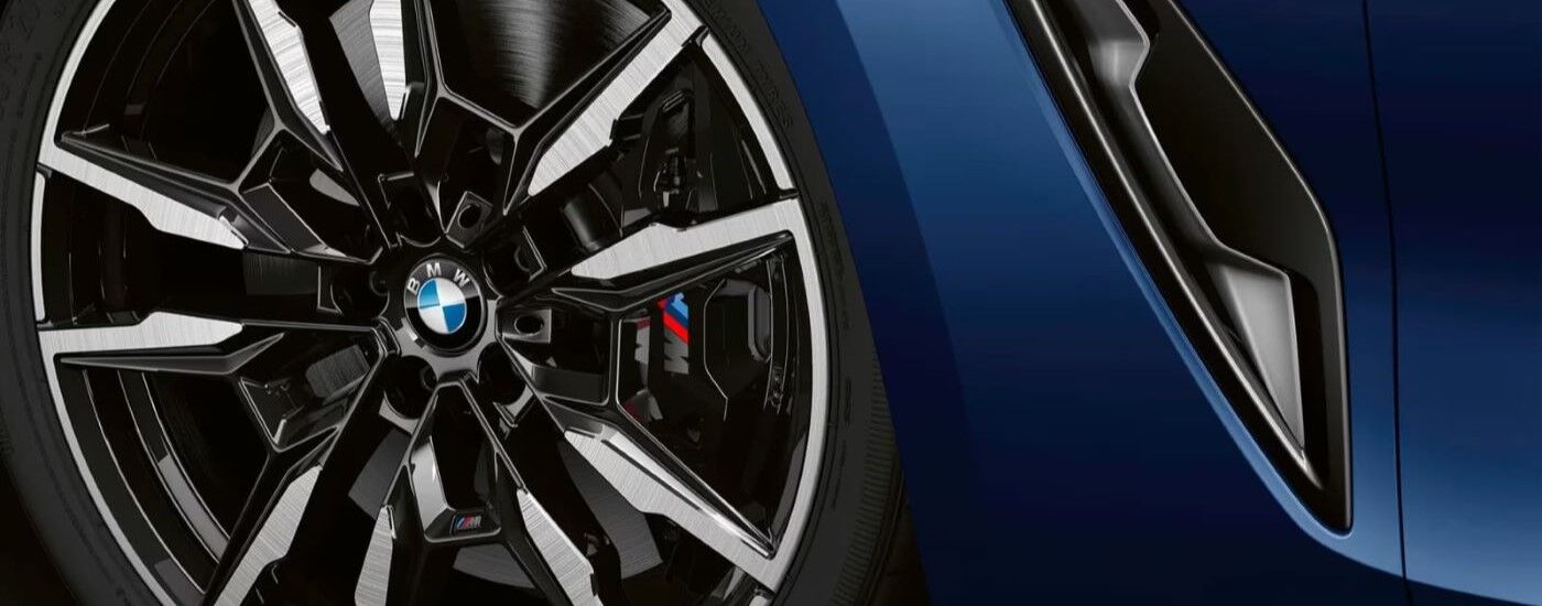 Rim and side on a blue 2024 BMW M850i