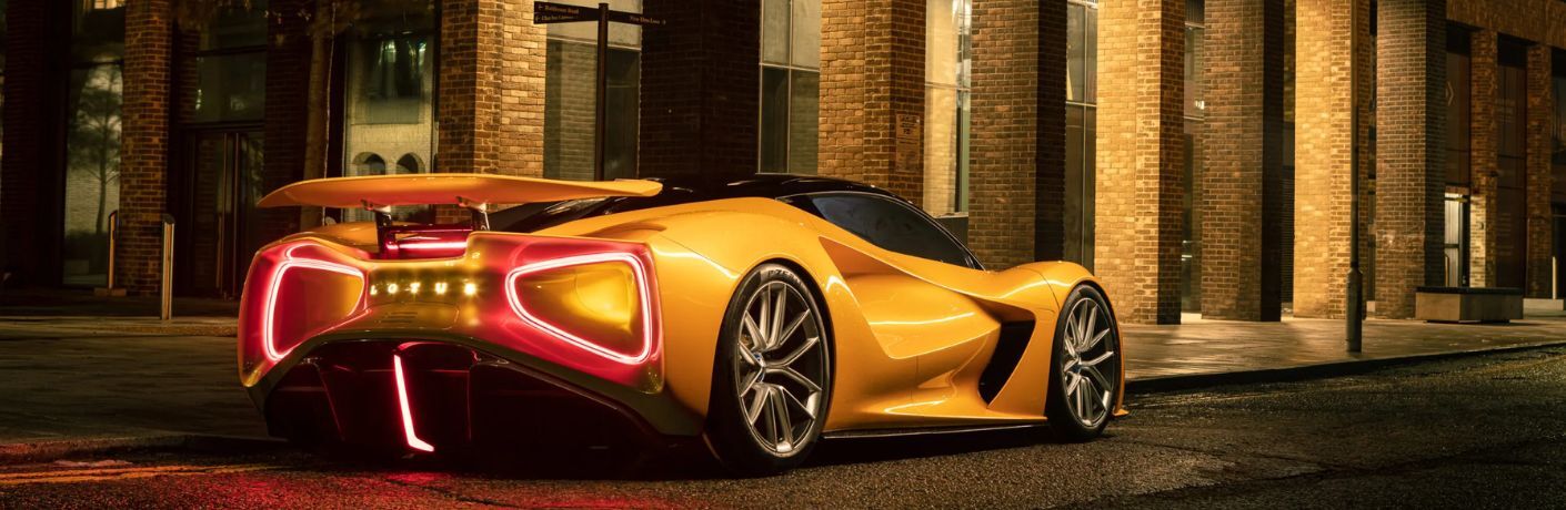 Rear profile of a 2022 Lotus Eviza on the side of a road