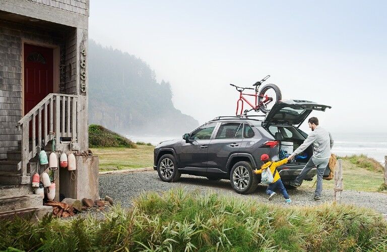 2021 Toyota RAV4 gray back view with family and cargo area