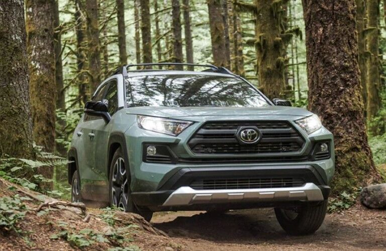 2021 Toyota RAV4 green front view on a trail