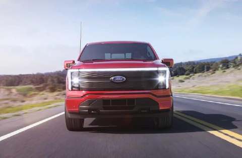 2022 Ford F-150 Lightning has power acceleration. Truck on paved highway