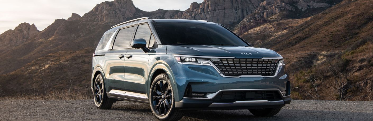 2024 Kia Carnival Parked on Dirt Terrain Near the Canyons Side-View