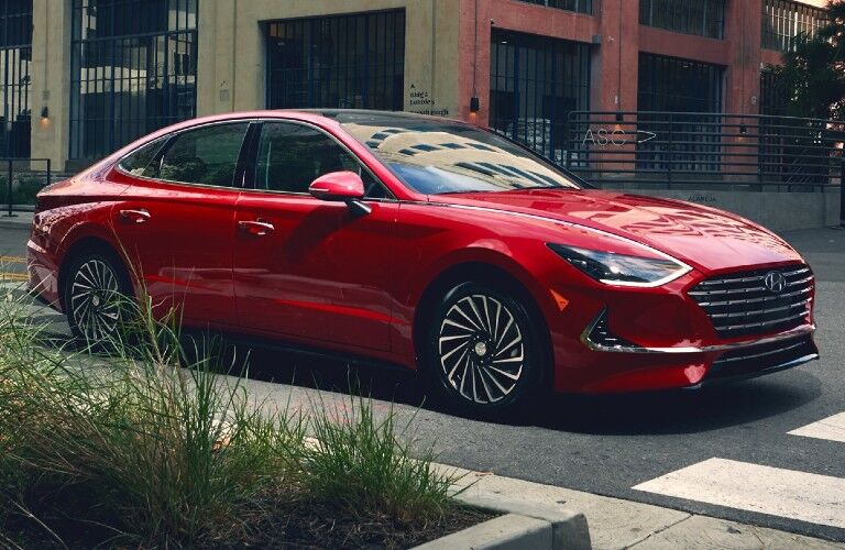 Front passenger angle of a red 2021 Hyundai Sonata Hybrid