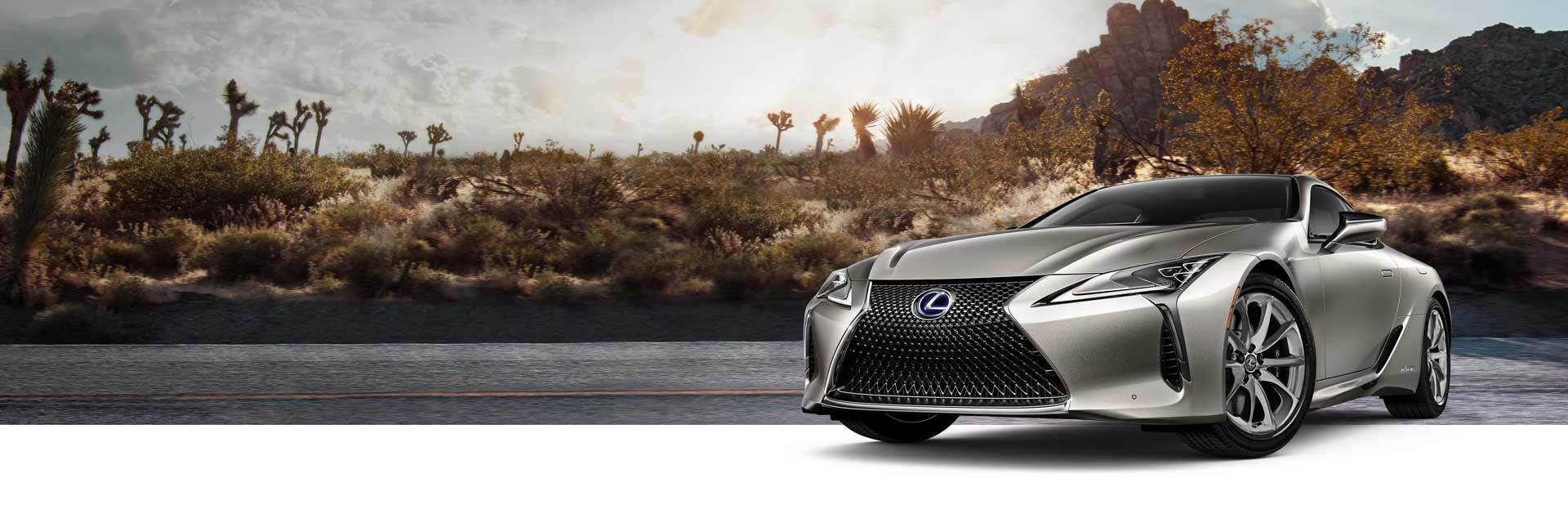 Exterior of the Lexus LC Hybrid shown in Atomic Silver on a desert background.