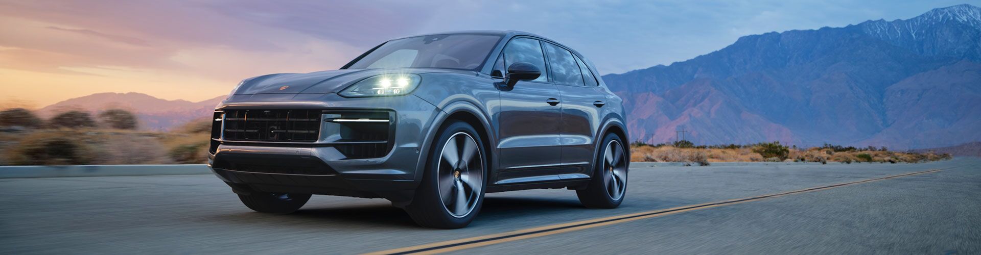 Group of happy women driving in a Porsche in