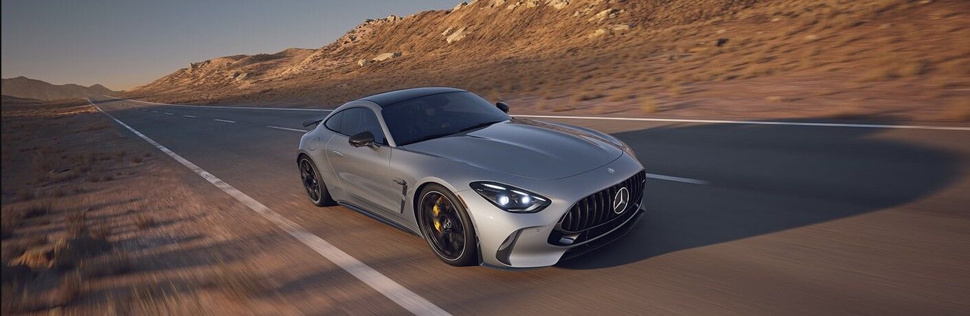 2026 Mercedes-Benz AMG ® GT-Class front view on a road