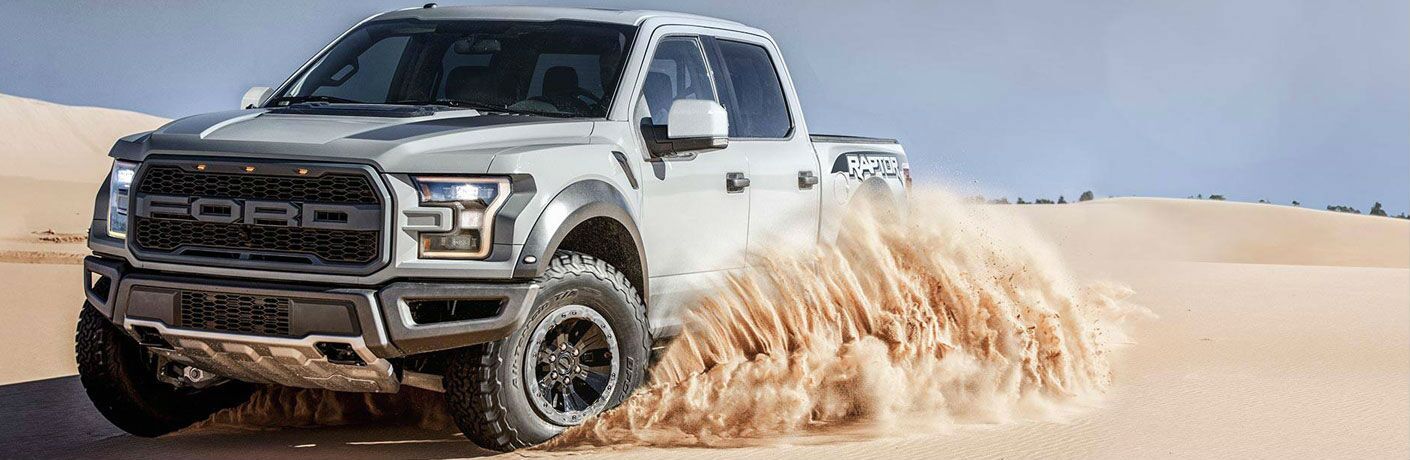 2018 Ford F-150 grey exterior front fascia driving side driving in sand dunes