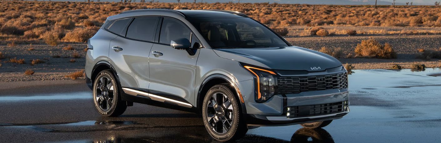 2026 Kia Sportage Hybrid side and front view