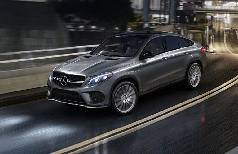 mercedes-benz gle coupe on wet city street