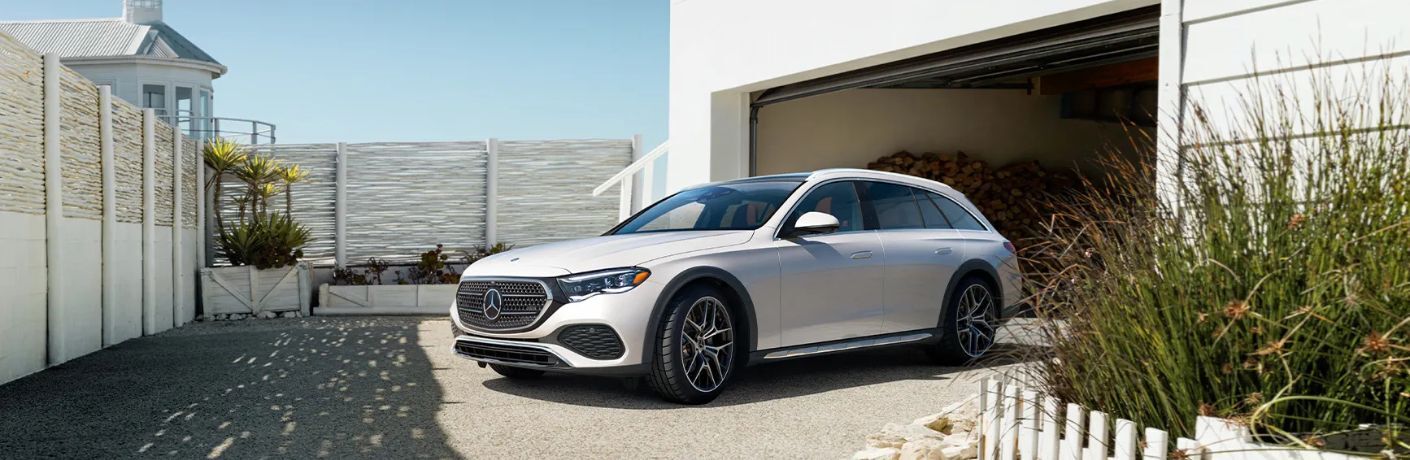Front-quarter view of the 2026 Mercedes-Benz E 450 4MATIC® All-Terrain Wagon White