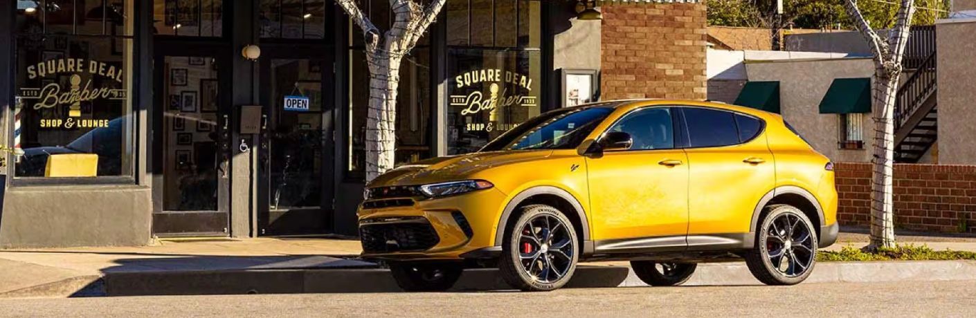 2024 Dodge Hornet parked on a street near a building