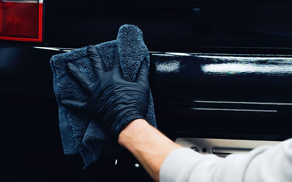 Automotive Spa Technician Polishing Vehicle