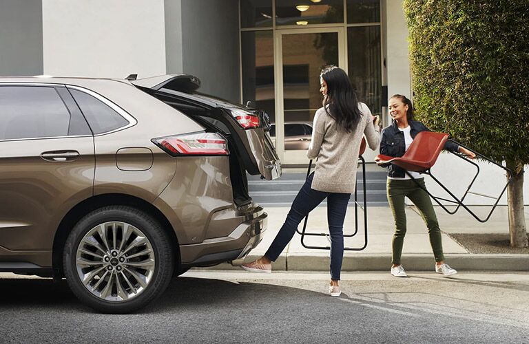 2021 Ford Edge with two women and chairs
