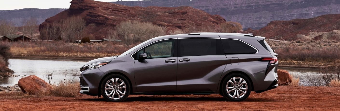 One gray color 2022 Toyota Sienna is parked near the mountains