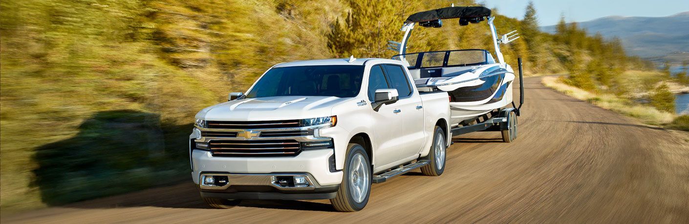 Front three-quarter view of the 2020  Chevrolet Silverado 1500 towing a boat