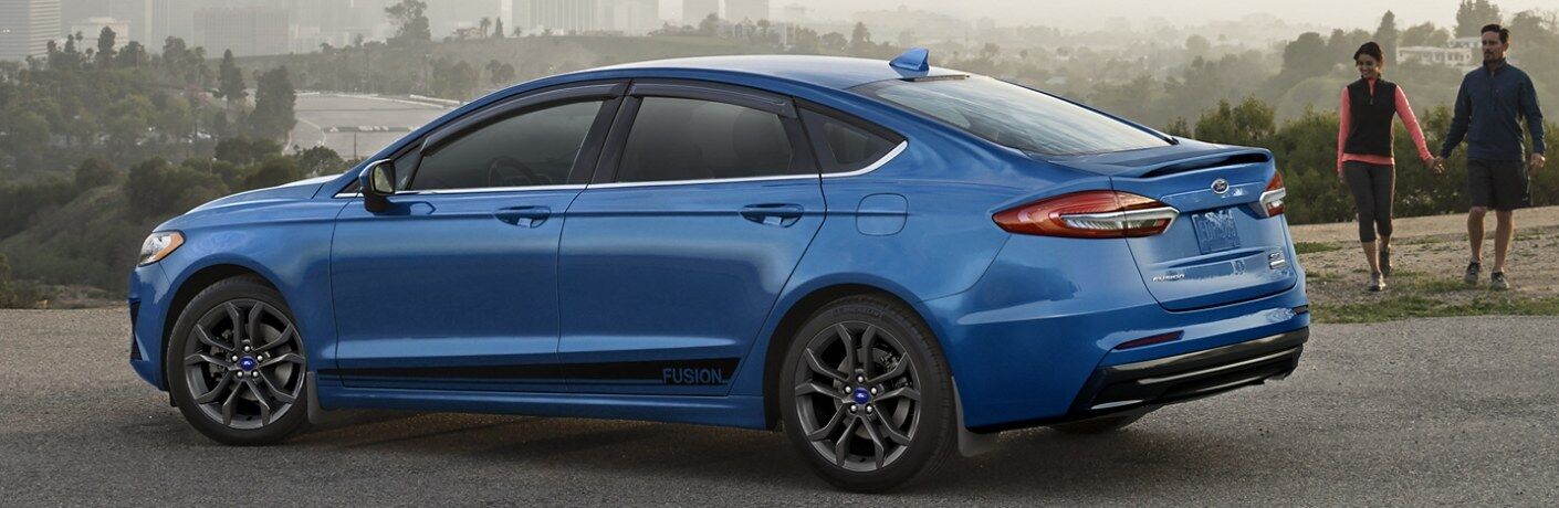 Rear driver angle of a blue 2020 Ford Fusion