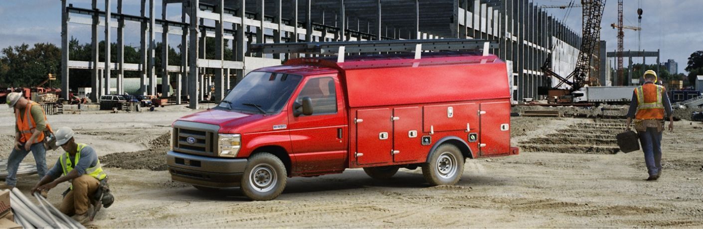 2024 Ford E-Series Cutway Red parked near construction site