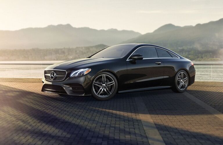 mercedes-benz e-class coupe with mountains in the background