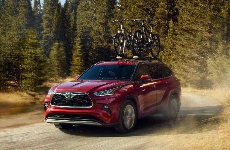 Front driver angle of a red 2021 Toyota Highlander
