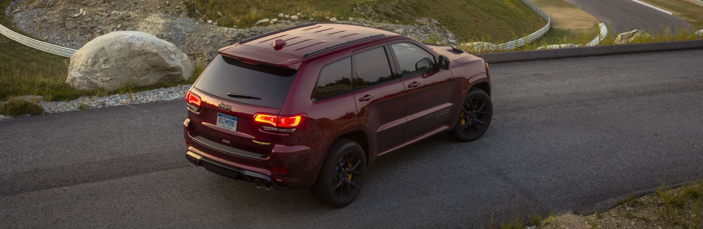 2021 Jeep Grand Cherokee driving down a rural road