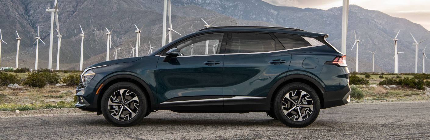 2024 Kia Sportage Hybrid side view on the road