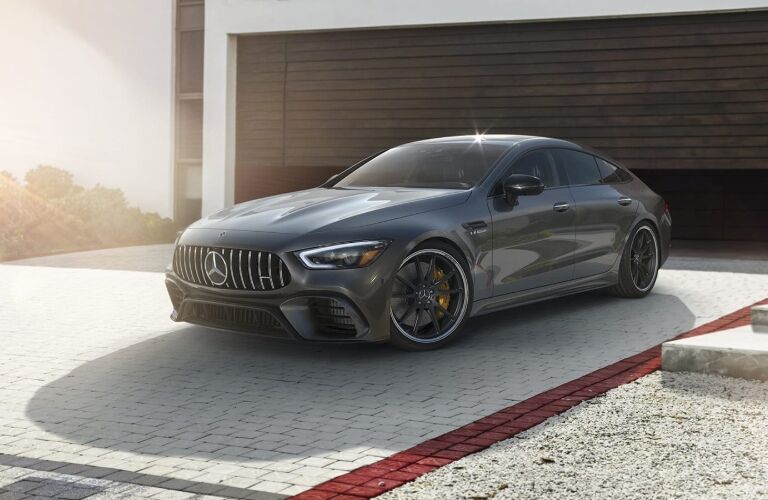 mercedes-amg gt 4-door coupe parked outside home garage