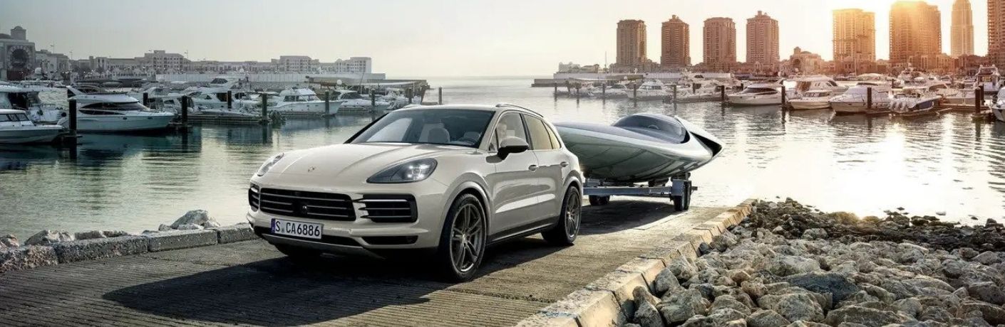 2022 Porsche Cayenne towing a boat
