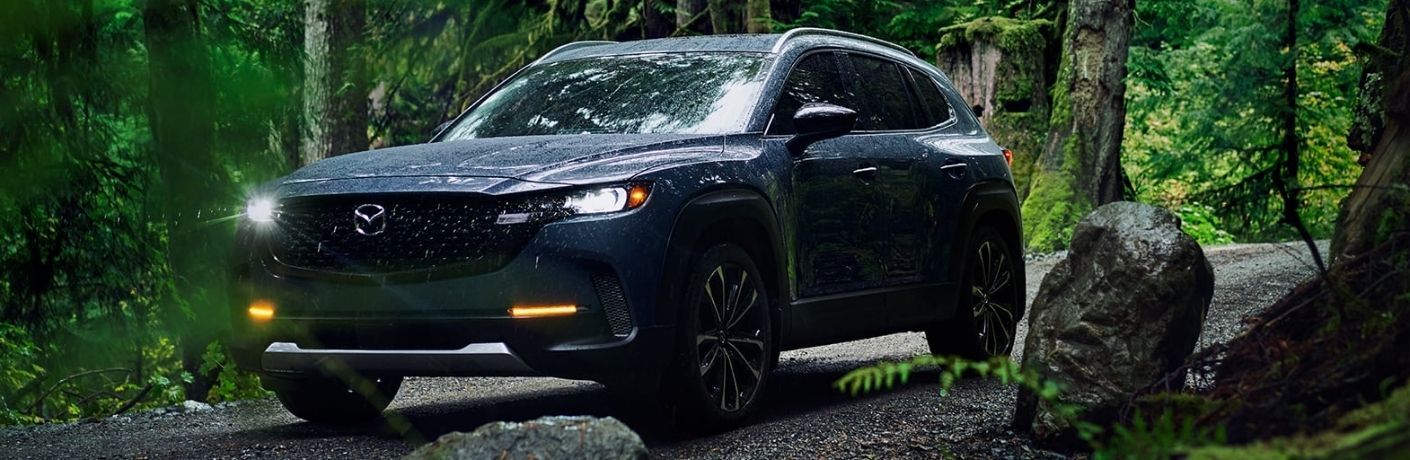 View of the 2023 Mazda CX-50 in a forest