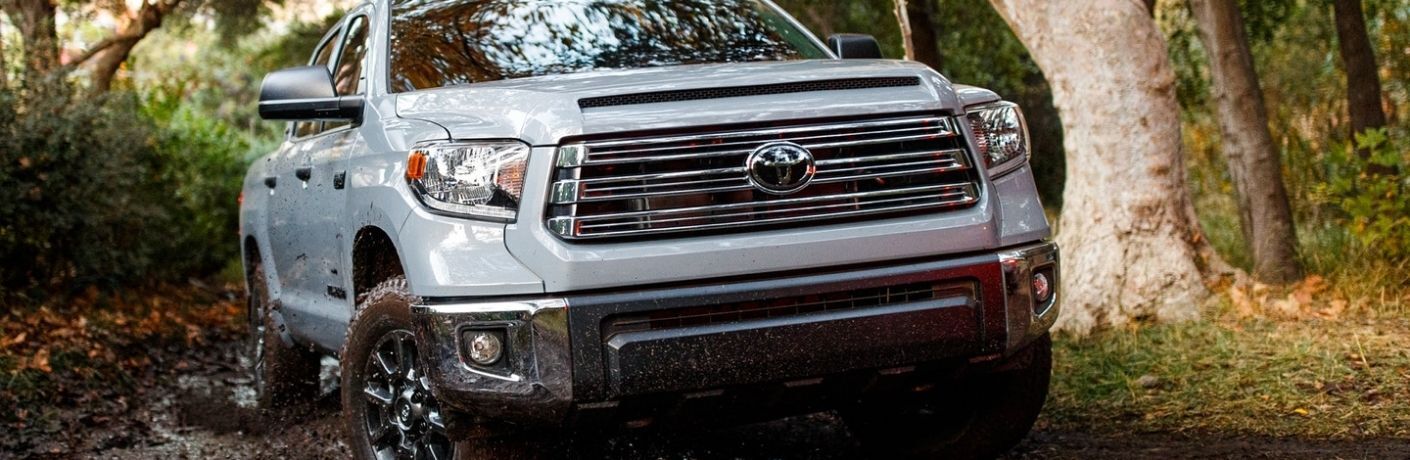 front view of a used truck in mud