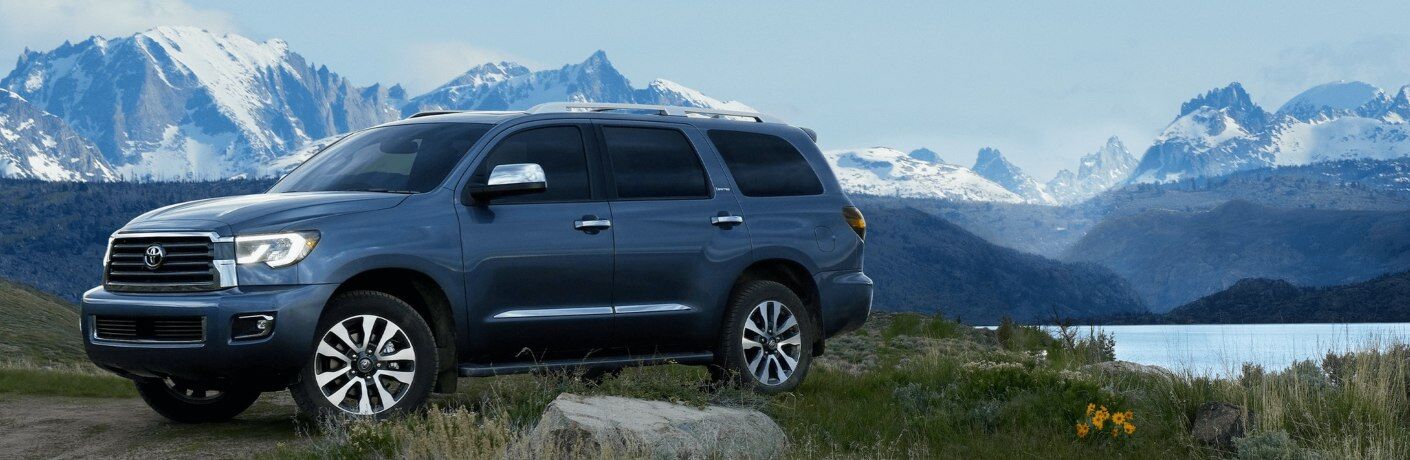2021 Toyota Sequoia gray side view in front of mountains