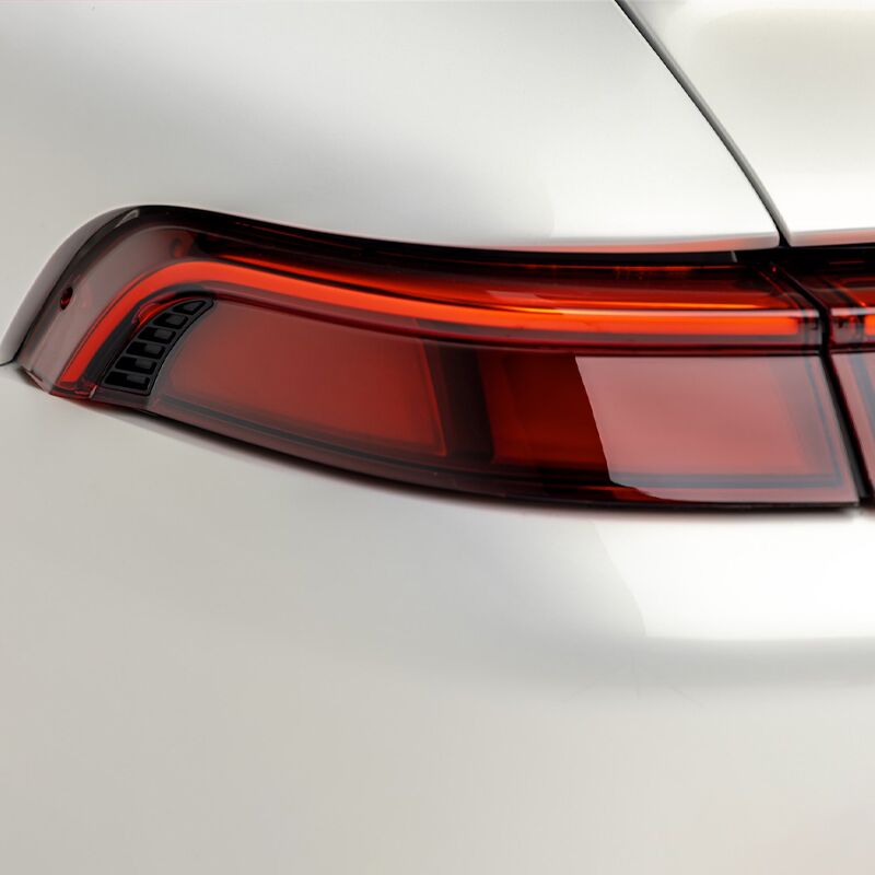 white Porsche Coupe tail light close up