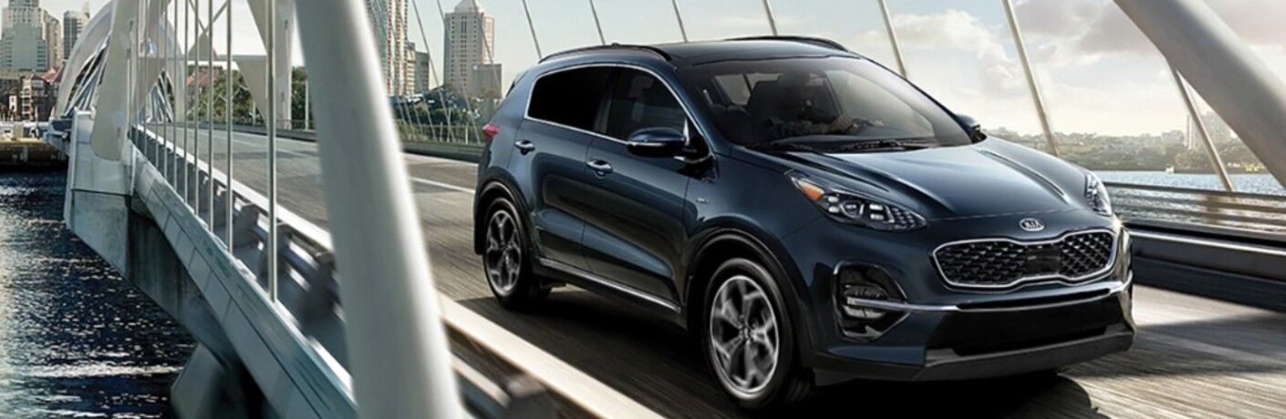 2021 Kia Sportage crossing a bridge