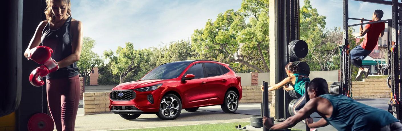 2024 Ford Escape ST-Line Select Plug-in Hybrid parked near a gym
