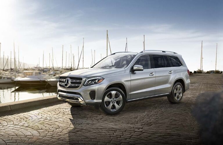 silver mercedes-benz gls parked by marina