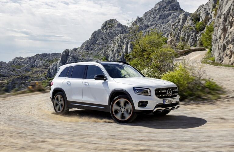 white mercedes-benz glb climbing mountain road