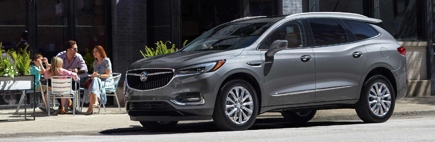 Front driver angle of a grey 2021 Buick Enclave