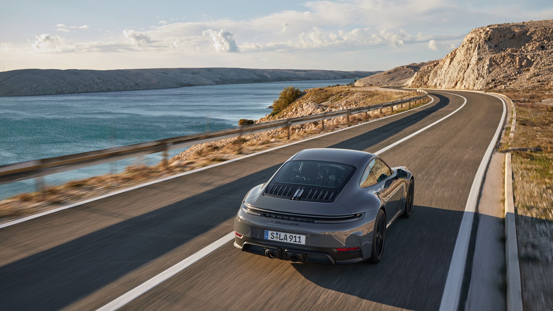 Porsche 911 Carrera GTS T-Hybrid coupe on the road – Champion Porsche Pompano Beach, FL